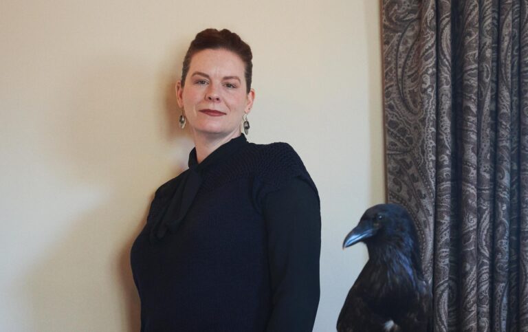 Emily Harmon with Buddy the raven