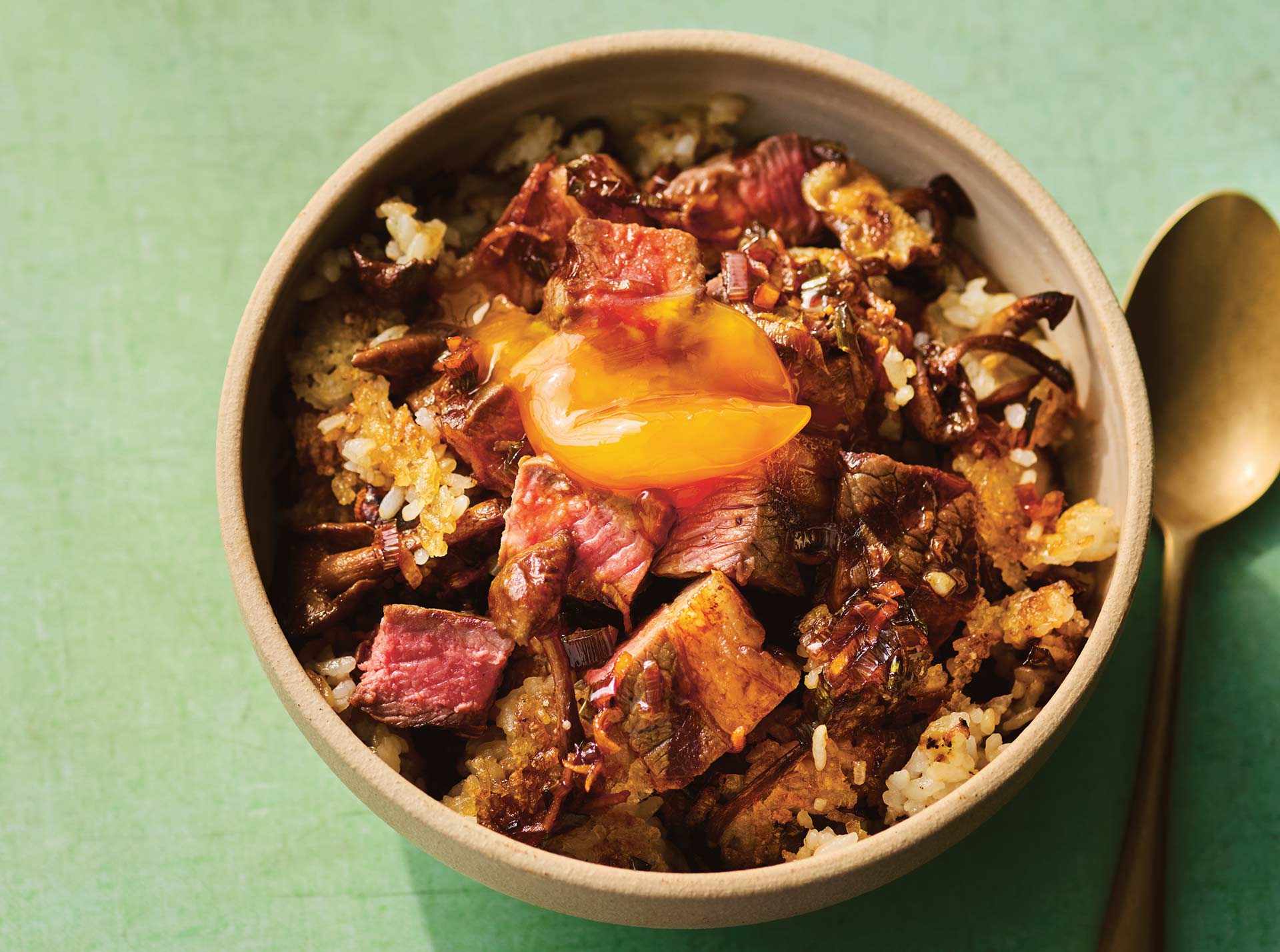 Ping Coombes soy-cured egg yolk with buttered steak, with mushroom rice bowl